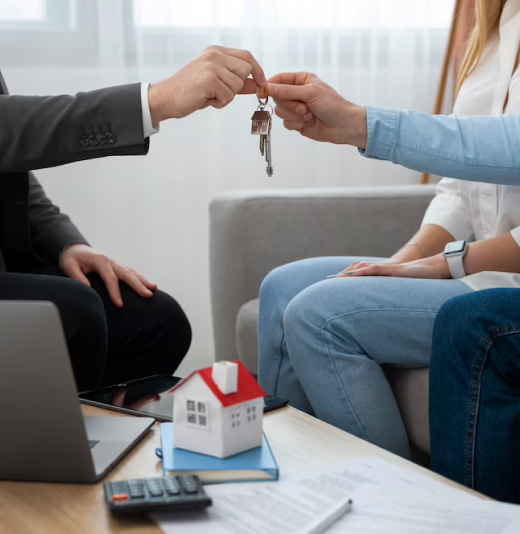 Attorney handing keys to a couple